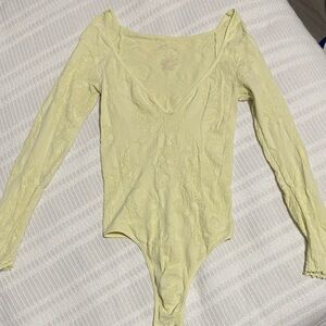 Free people Long Sleeve V-Neck Lace Bodysuit in Pale Yellow